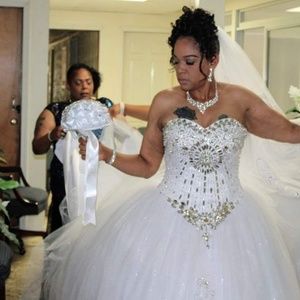 Wedding dress with detachable train and veil.